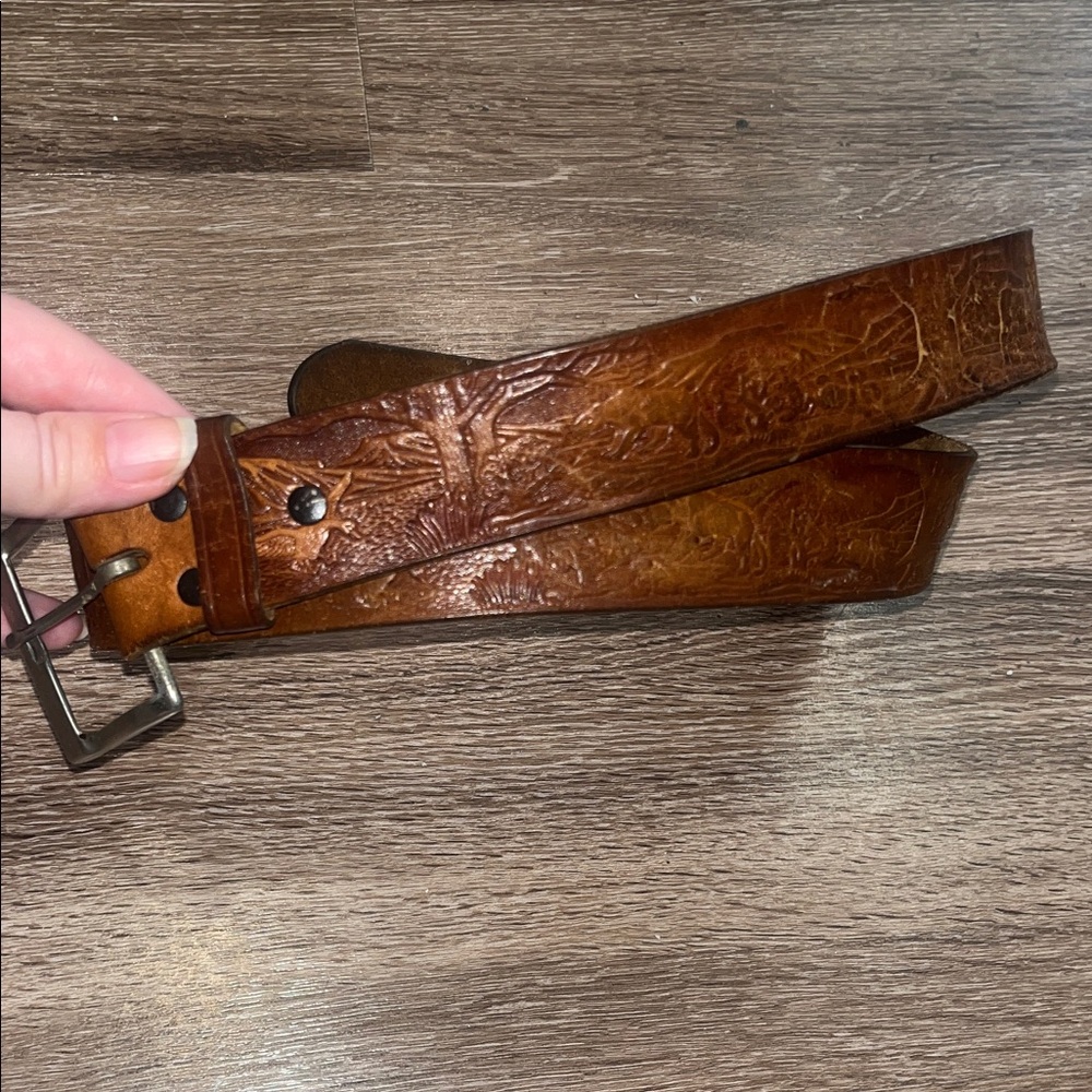 Leather belt with animal carving